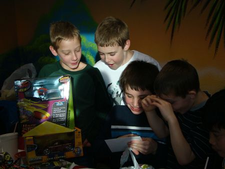 Birthday boy opening gifts 2