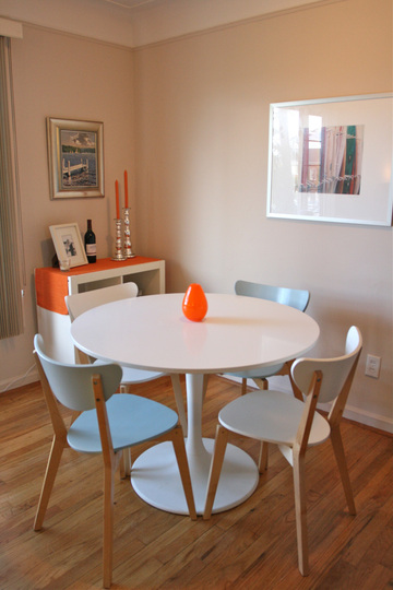 Kate - white + orange dining area